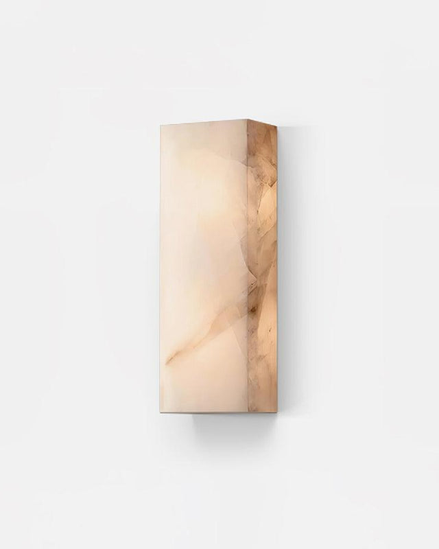 Alabaster wall sconce ALABA No.03, rectangular white alabaster block glowing on a plain wall