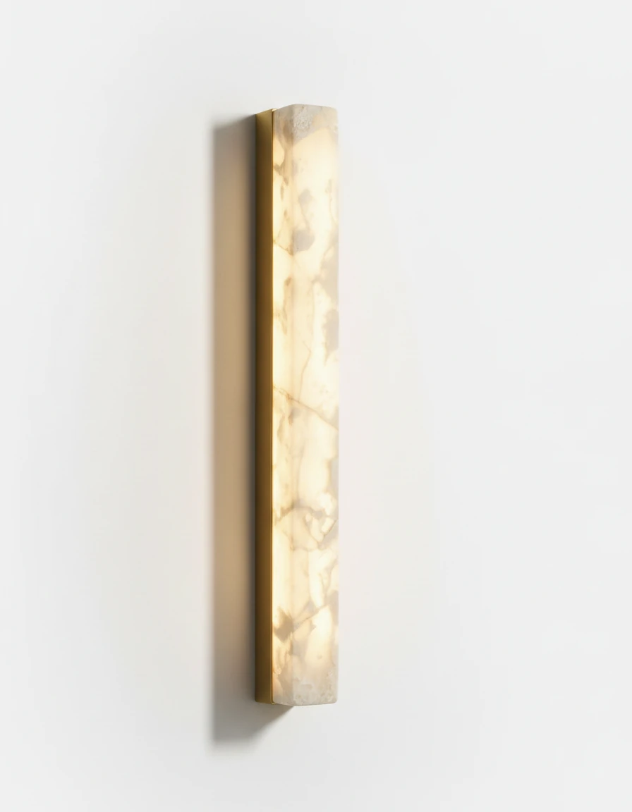 Alabaster wall sconce NEBBIA No.02, 32 in column on a brass bar, switched on, angled view on a white wall