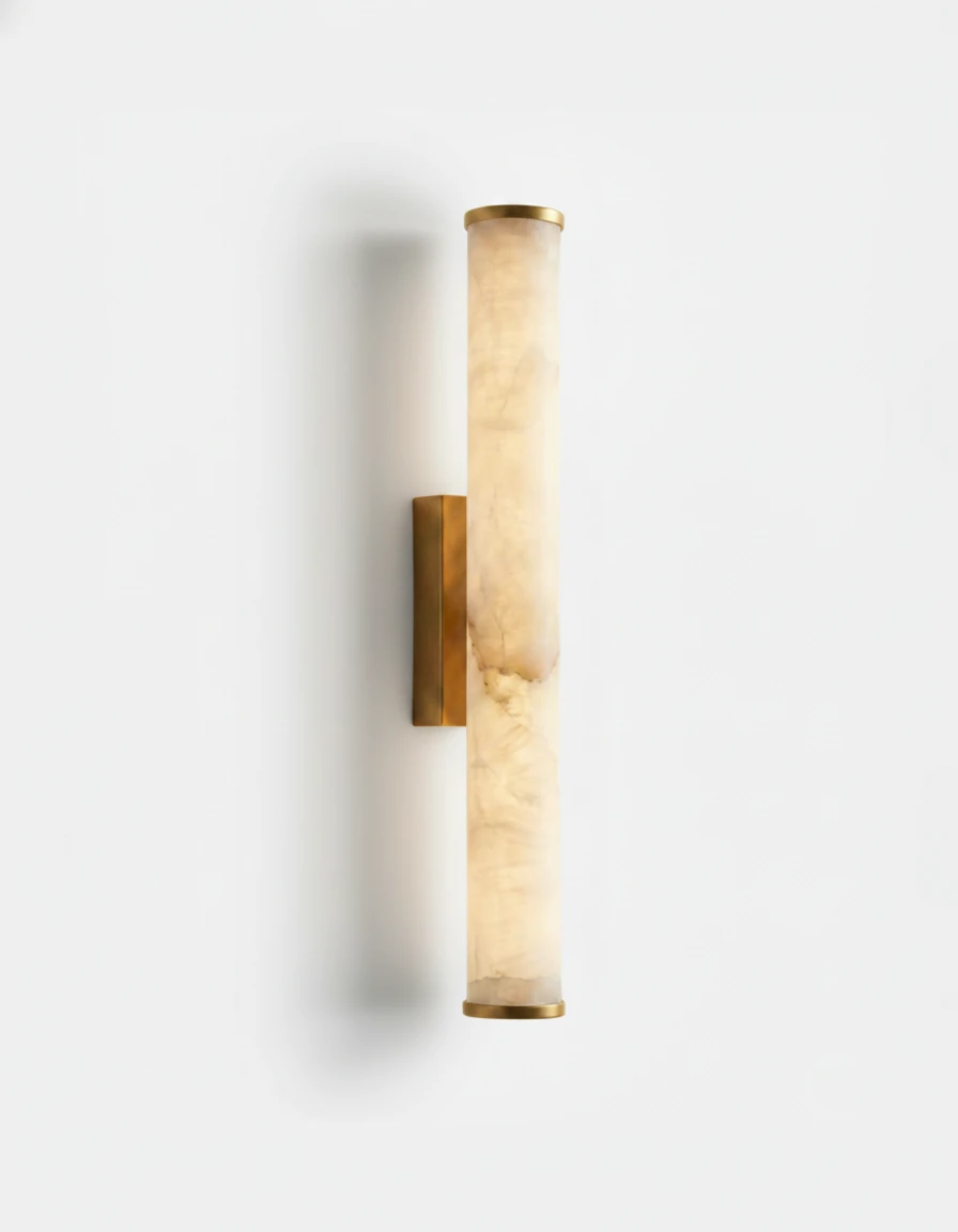 Alabaster wall sconce NEBBIA No.01, 20 in tube on a Warm Gold bracket, lit against a plain white wall