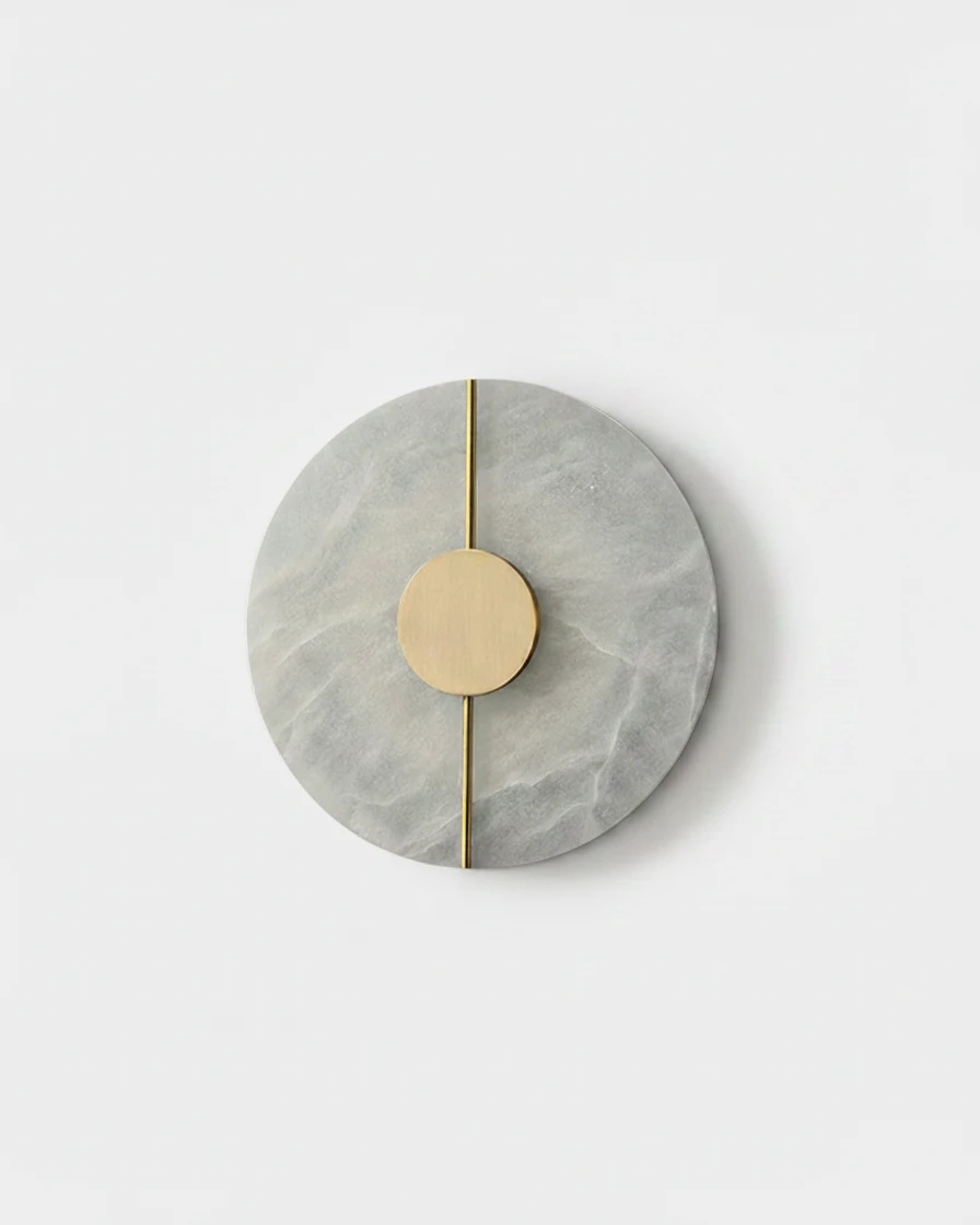 Alabaster wall sconce OLIVA No.03 Round, gray-veined alabaster disc with a brass center dot and thin brass line, unlit