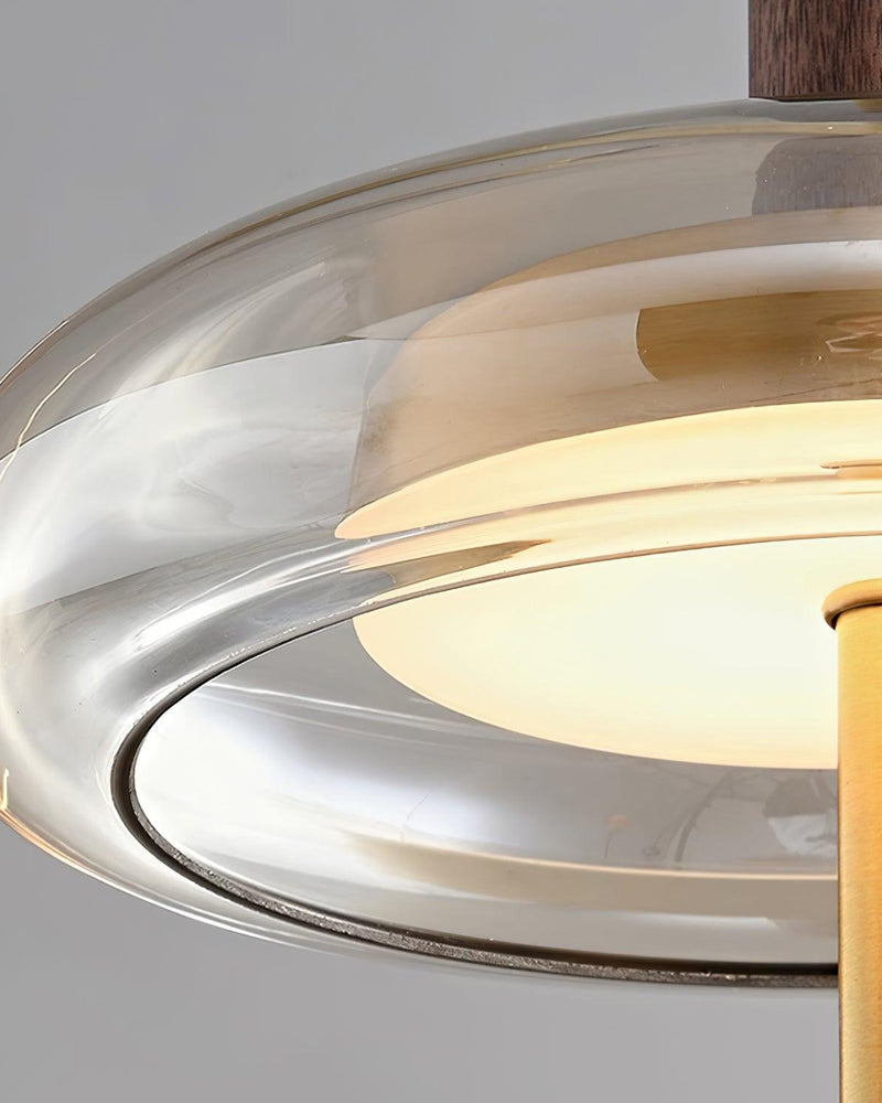Close-up of the smoked amber glass rim of the NOCE No.01 amber glass pendant light with the brass rod