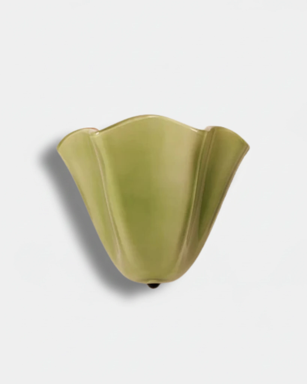 Brass wall sconce DALIA No.03 with a deep green hand-blown glass corolla shade, unlit on a white wall