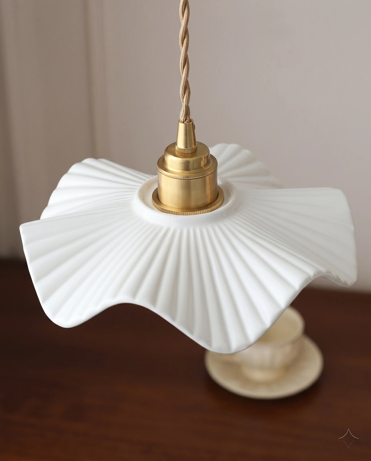 Close-up of the fluted white ceramic petal shade and copper socket of the ALBA No.01 ceramic pendant light
