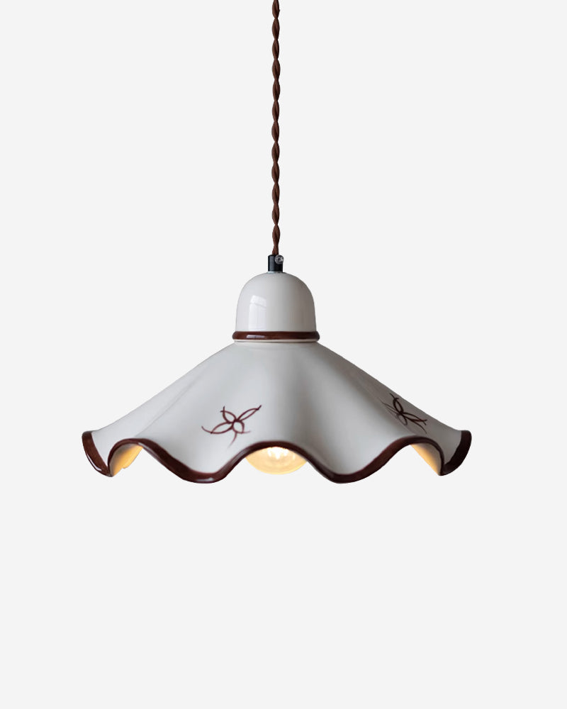 Ceramic pendant light CAPRI No.01 Capeline, hand-painted scallop shade switched on with a warm glow under the wavy rim