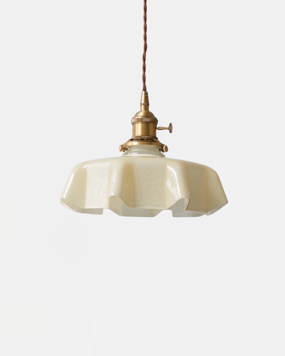 Ceramic pendant light CORA No.01 in sand, pale scalloped porcelain shade with brass hardware, unlit