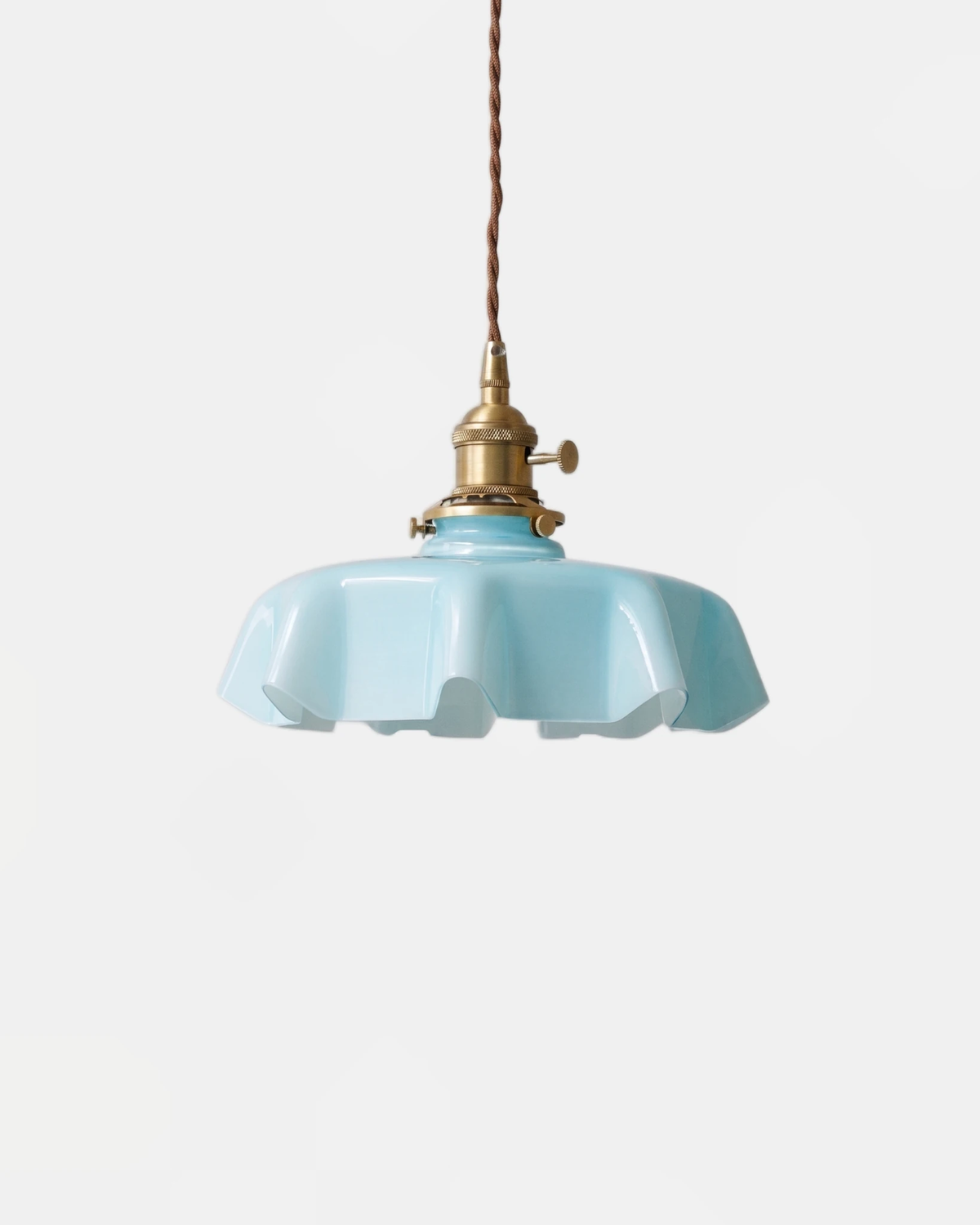 Ceramic pendant light CORA No.01 in sky blue with a scalloped rim, brass fitting and braided cord, unlit