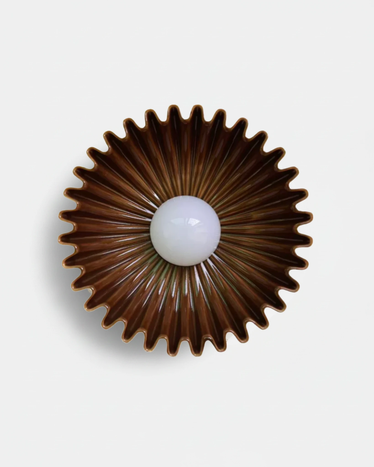 Ceramic wall sconce RAGGI No.01 in Bronze Copper, brown glazed sunburst rays around a white globe, unlit