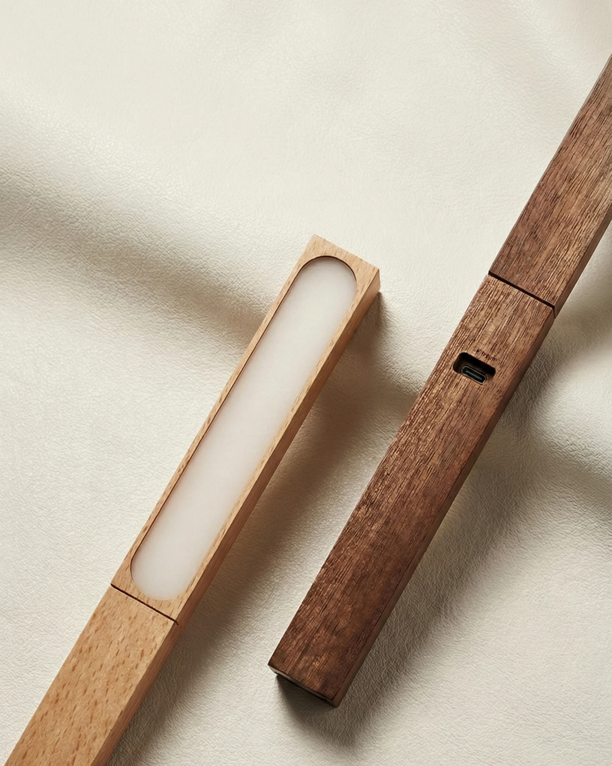 Close-up of two detached RAMO No.01 cordless desk lamp heads showing the LED panel and USB-C port