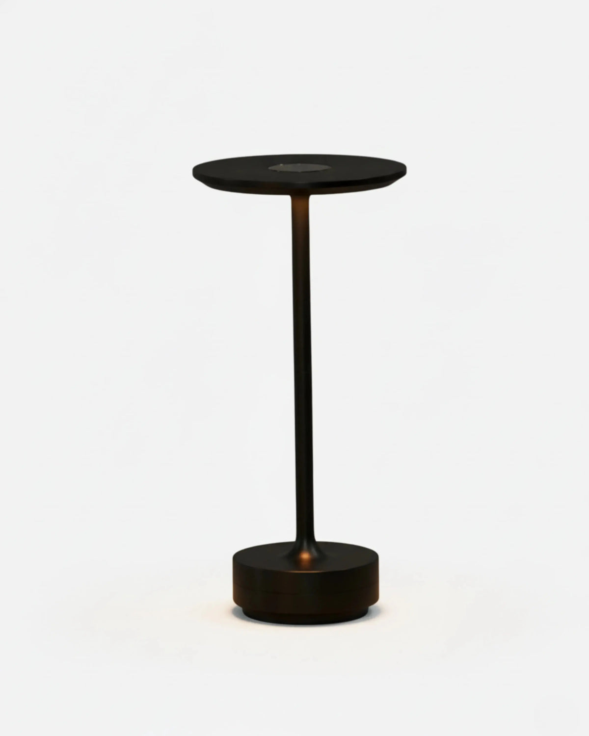 Cordless desk lamp LUMA No.05 in Volcano Black, disc top switched on, matte stem and round base