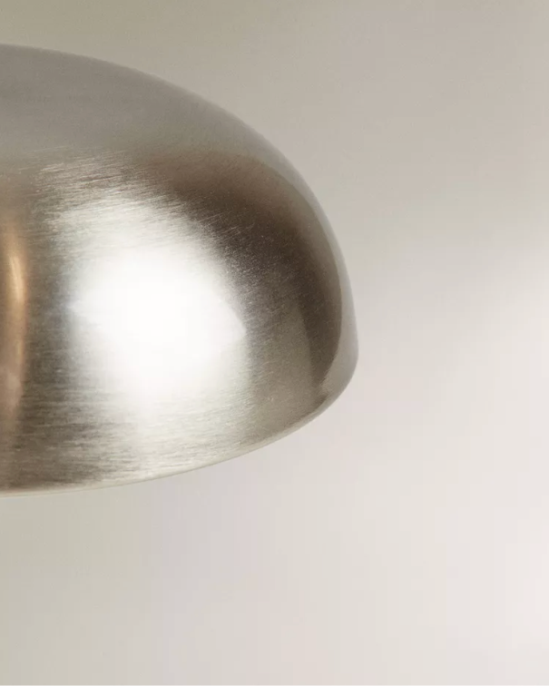 Close-up of the brushed silver dome shade of the cordless mushroom lamp LUMA No.02 in Mirror Argent