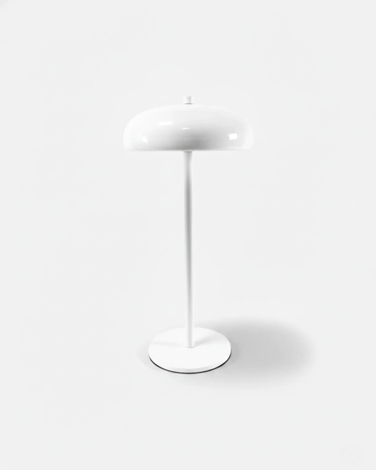 Cordless mushroom lamp DOMA No.01 in Ivory White, all-white dome shade, thin stem and weighted base, unlit