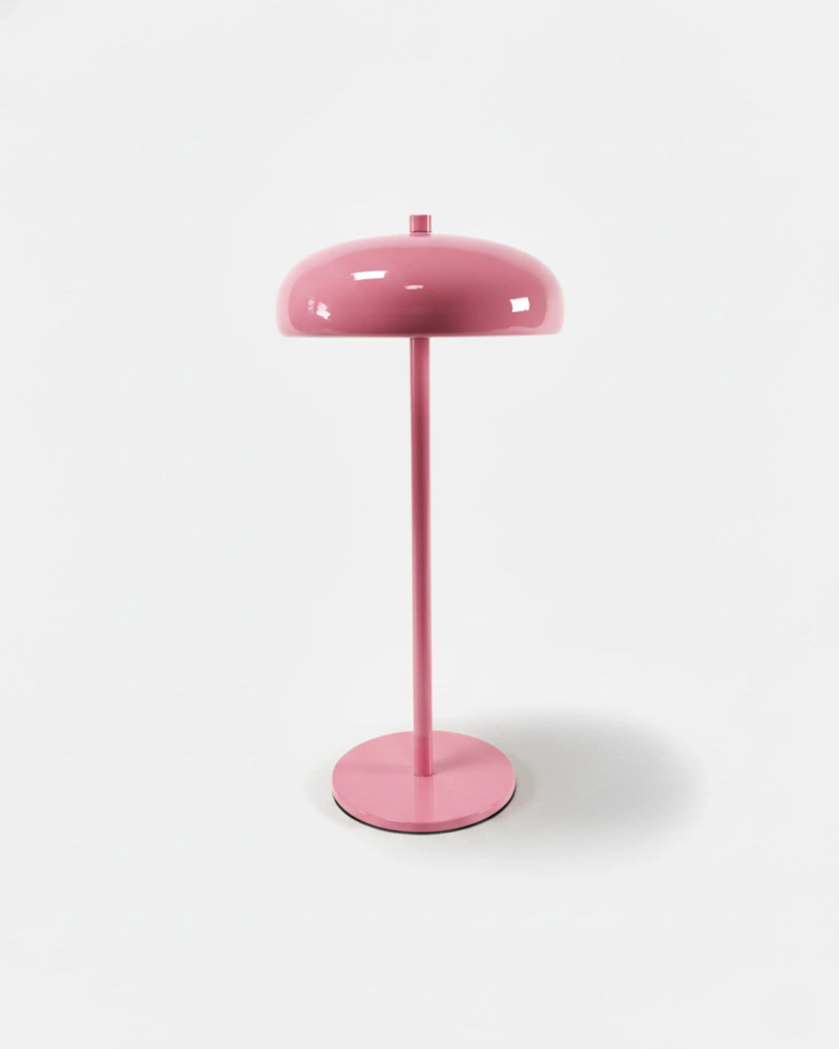 Cordless mushroom lamp DOMA No.01 in Powder Pink, pastel pink mushroom dome on a matching slim stem, unlit