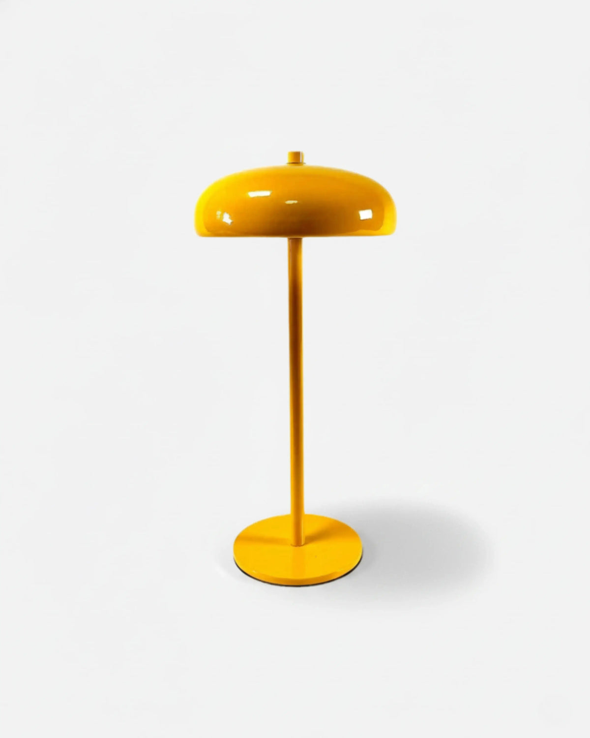 Cordless mushroom lamp DOMA No.01 in Sun Yellow, bright lacquered dome and stem on a disc base, unlit packshot