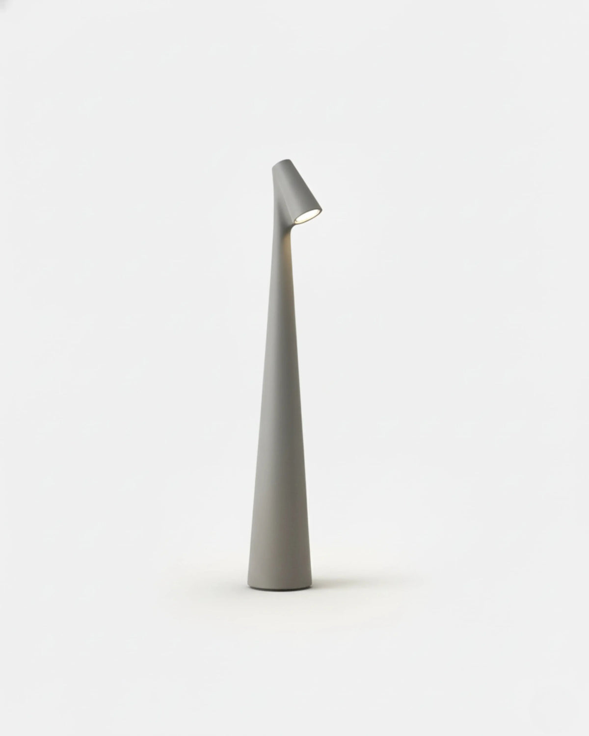 Cordless reading lamp TRIESTE No.01 in Grey, slender tapered body and angled downlight head, unlit
