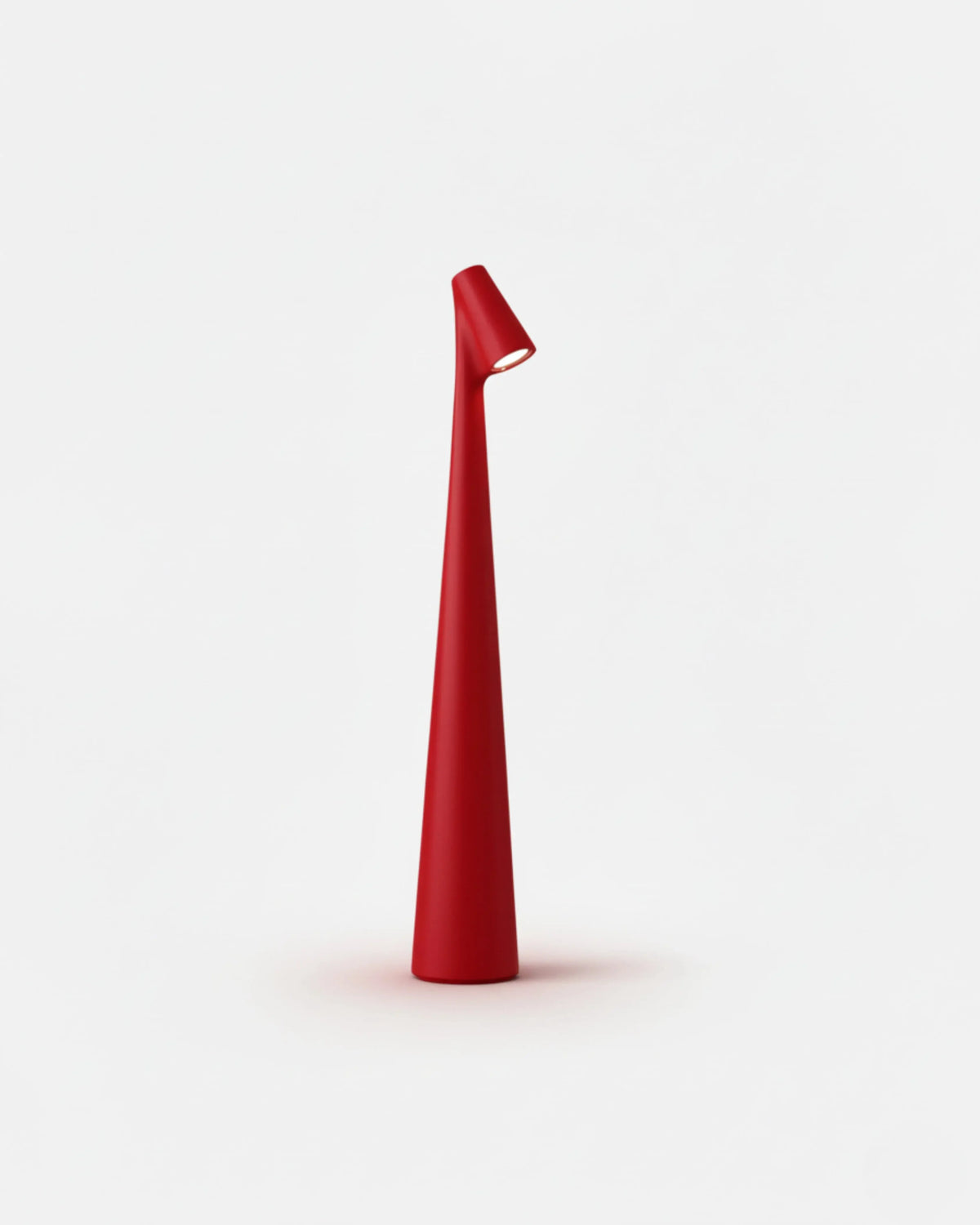 Cordless reading lamp TRIESTE No.01 in Red, slim conical body with a tilted LED head, unlit