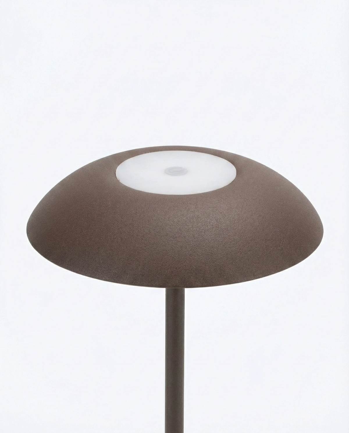 Close-up of the brown dome shade and top touch button of the PESCARA No.01 cordless table lamp