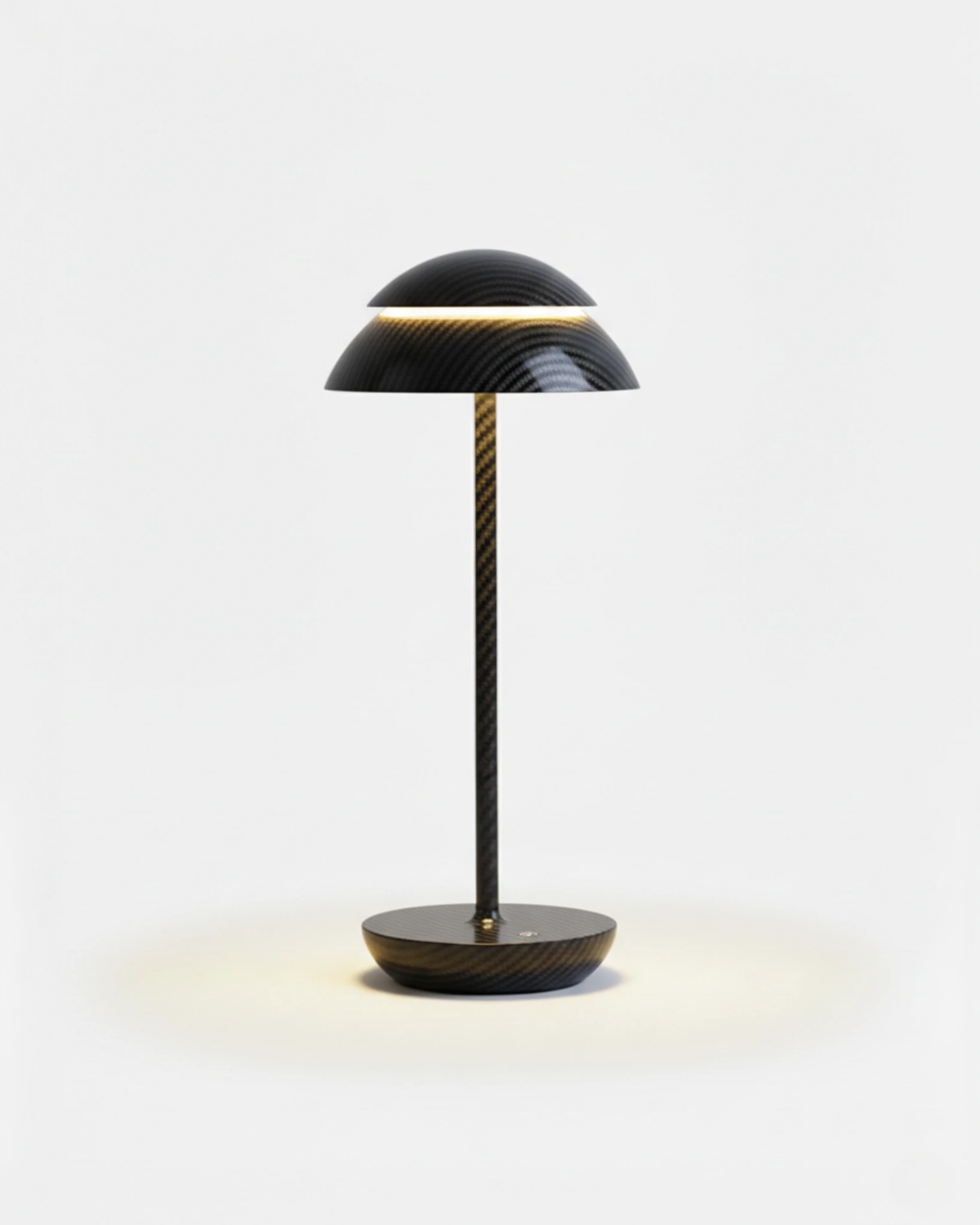 Cordless table lamp CALMA No.01 in Matte Black, textured black dome cap with a lit ring on a black disc base