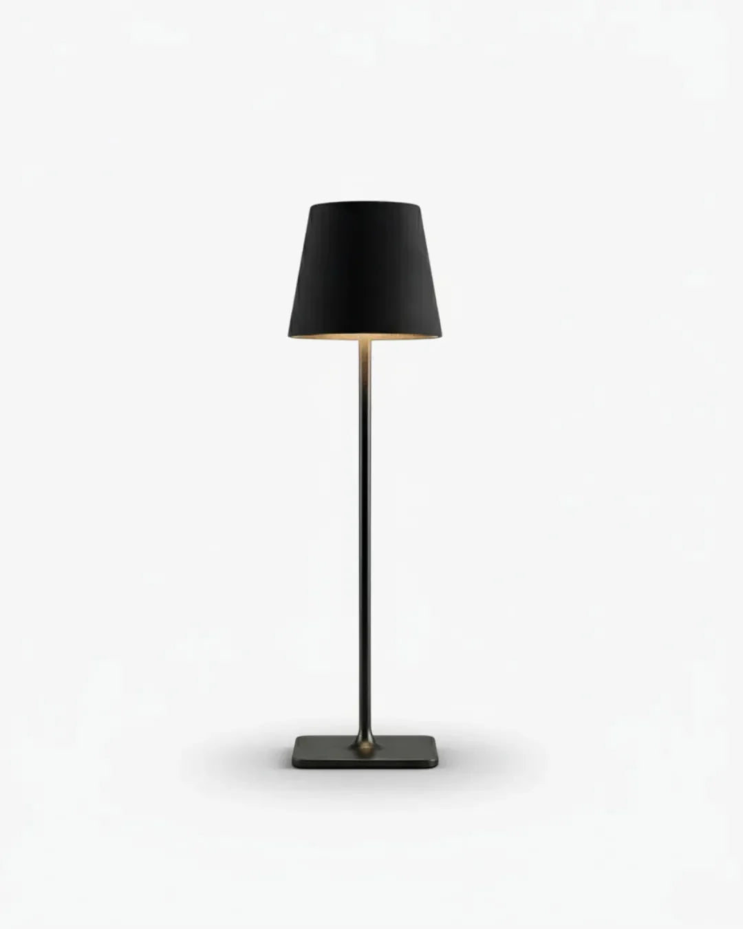 Cordless table lamp FOGGIA No.01 in Matte Black, slim stem with a cone shade on a square base, switched on