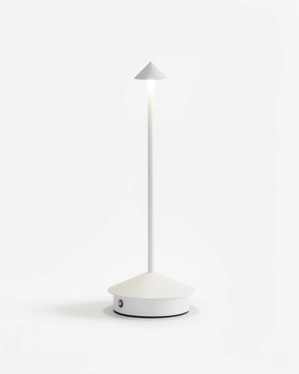 Cordless table lamp FERRARA No.01 in Pure White, slim stem lamp with a lit cone head on a white background