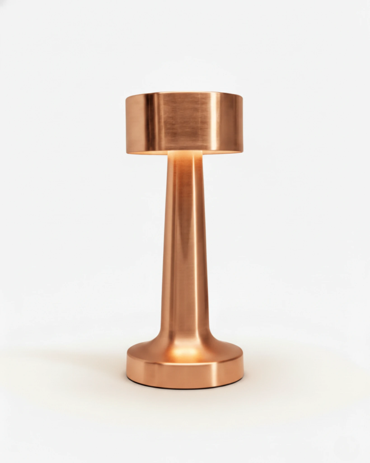 Cordless table lamp ISOLA No.01 in rose gold, brushed dumbbell body on a round base, unlit