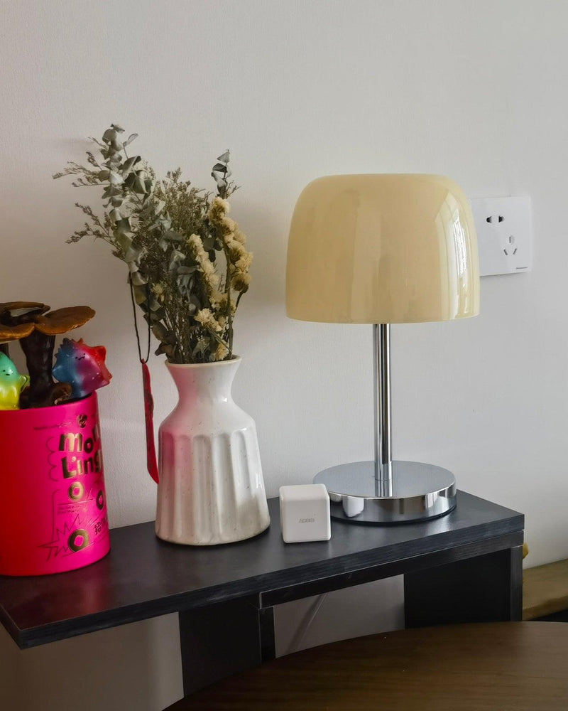Glass table lamp VENEZIA No.01 with cream shade, unlit, on a black shelf with white vases and dried flowers