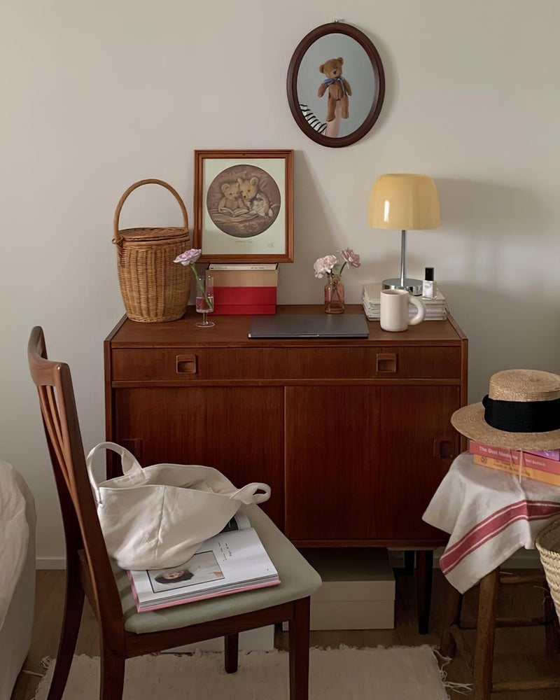 Glass table lamp VENEZIA No.01 on a mid-century wood sideboard with a chair and framed pictures, unlit