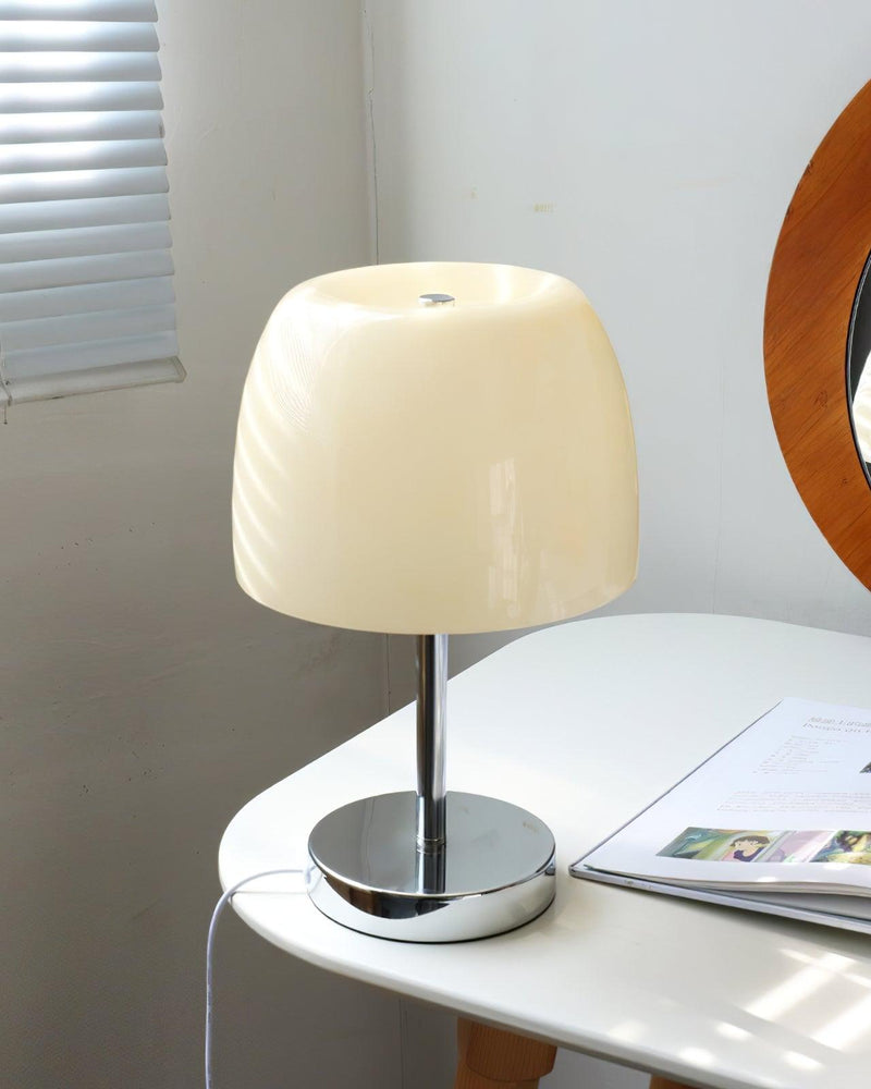 Glass table lamp VENEZIA No.01 with pale shade, unlit, on a white table by a window blind and a round mirror