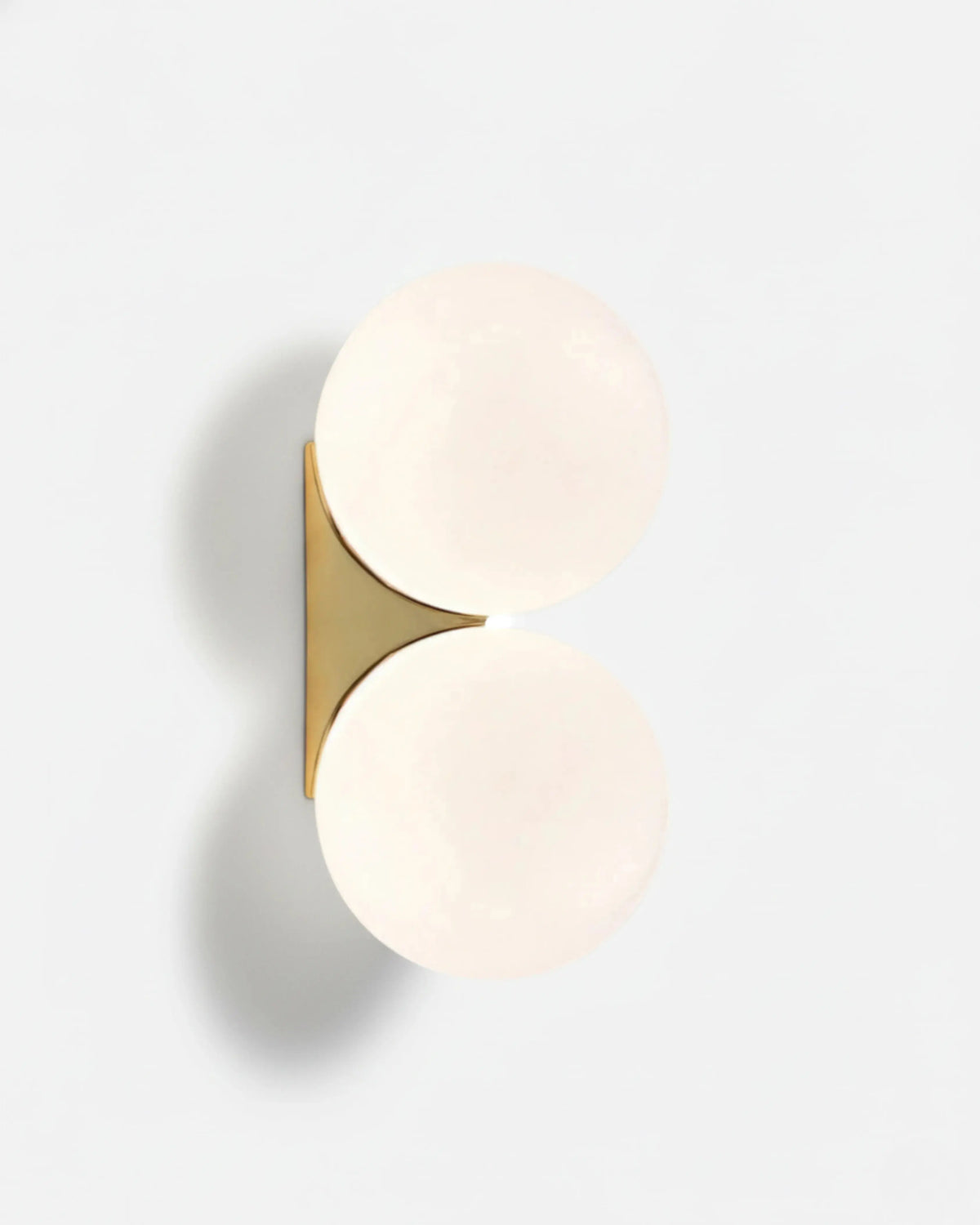 Globe wall sconce AURA No.03 double, two lit opal globes on a triangular brushed brass bracket