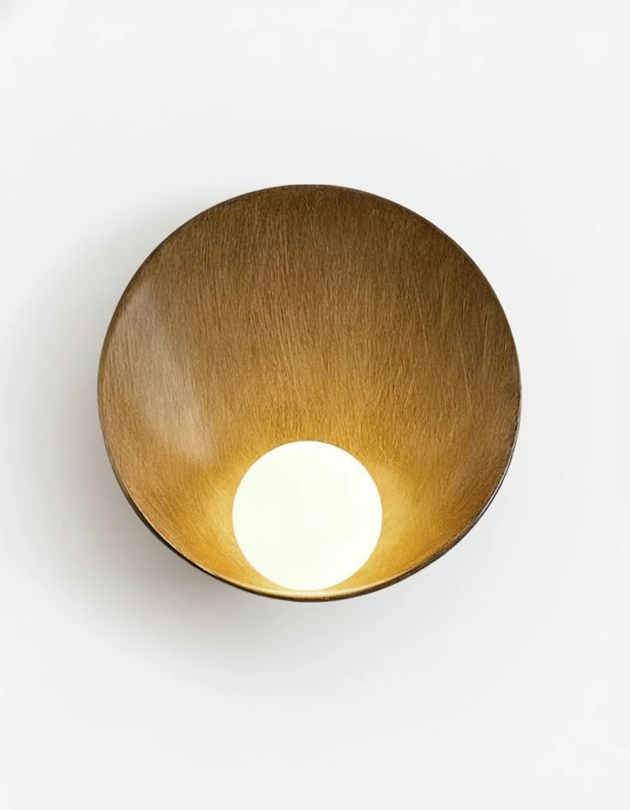 Globe wall sconce OASI No.01 in warm brown, tilted resin shell with the opal glass globe lit