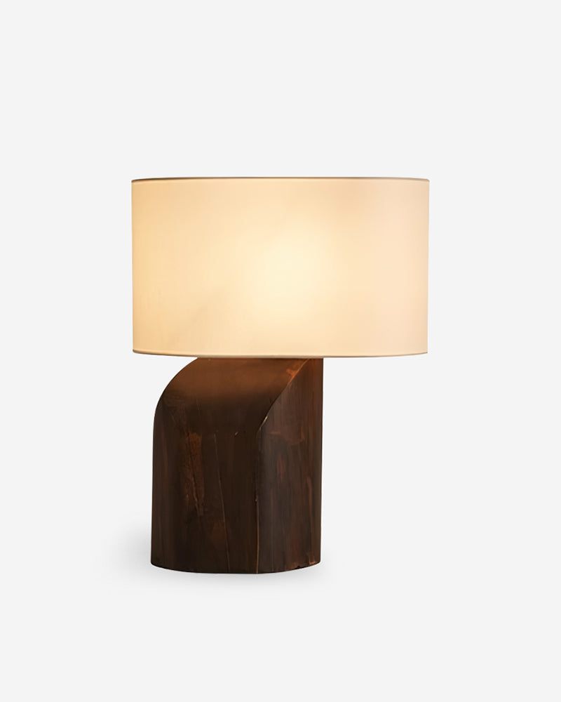Linen shade table lamp ROCCA No.02, sculptural curved dark walnut base with a cream linen drum shade, lit