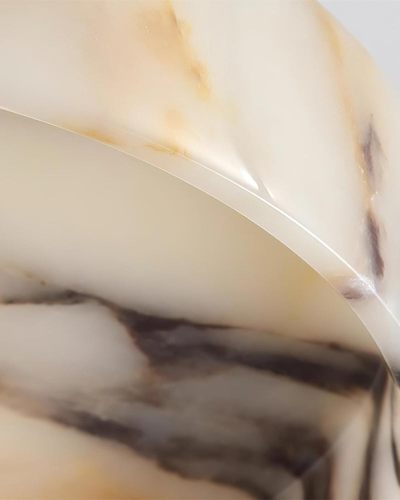 Close-up of the purple and gold veining on the marble dome of the marble wall sconce NUVOLA No.01