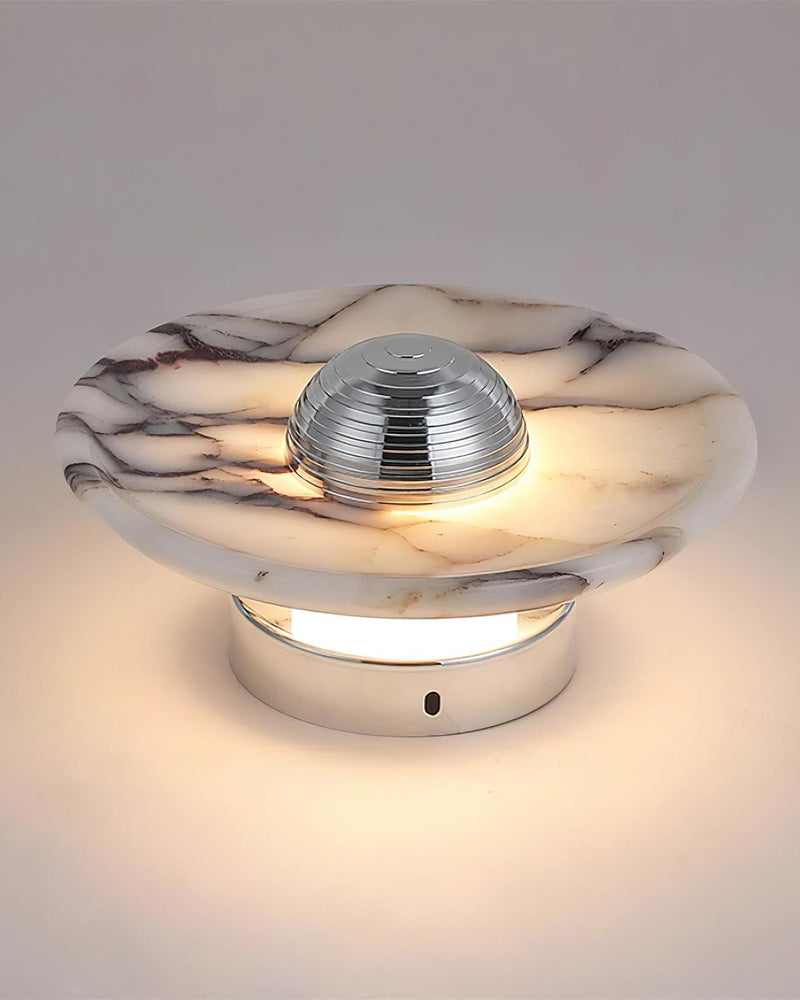 Marble wall sconce LATTE No.01 in Polished Chrome, side view switched on with light washing over the disc