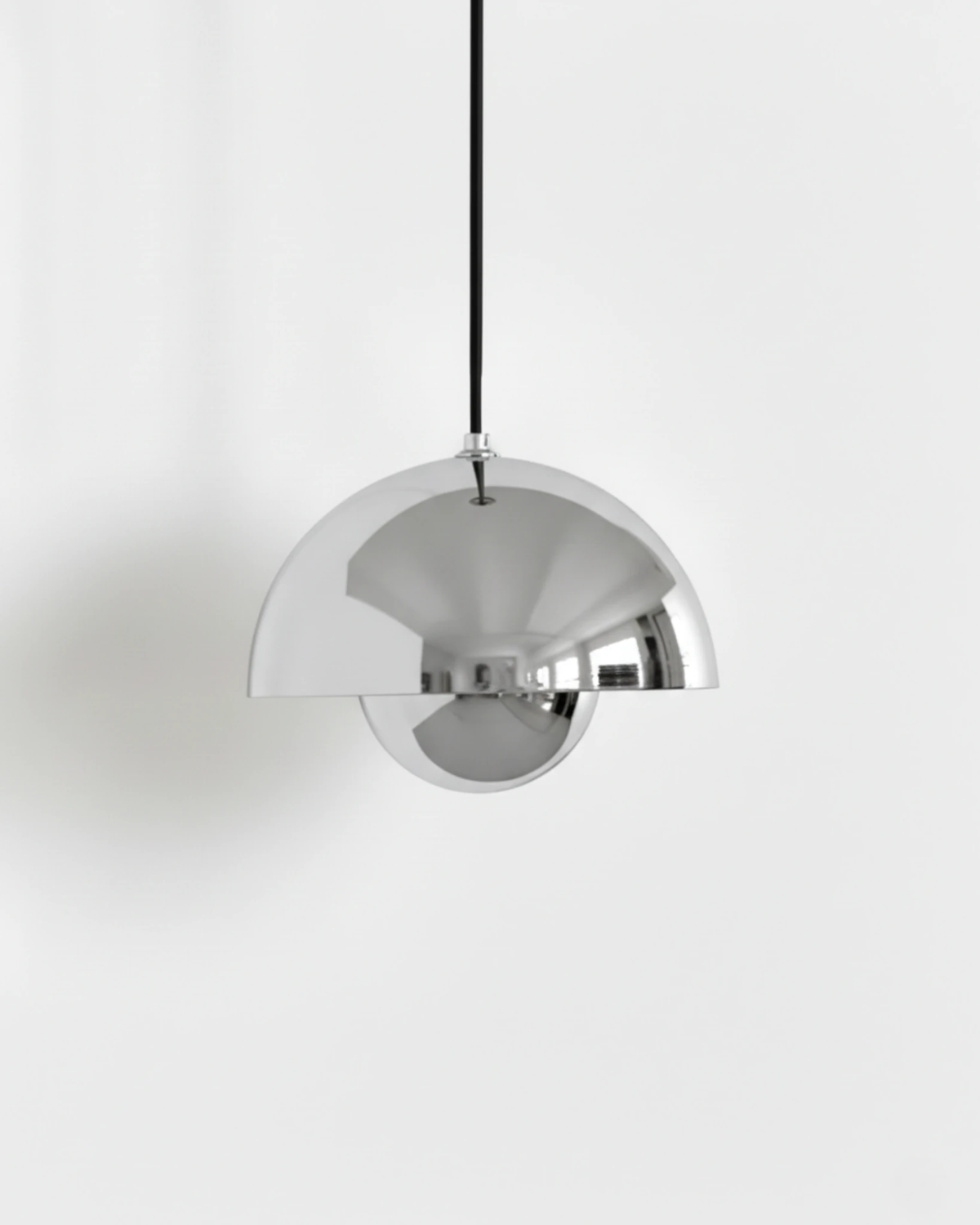 Modern pendant light ALTO No.01, medium 9 in, polished chrome finish reflecting the studio background