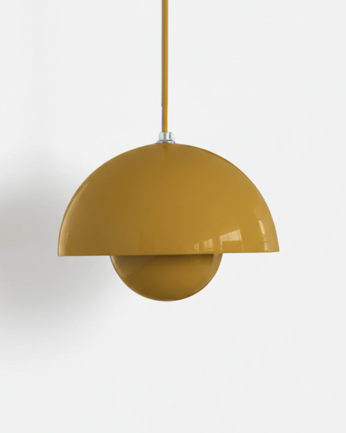 Large 15 in modern pendant light ALTO No.01 in mustard yellow lacquer hanging from a yellow cord