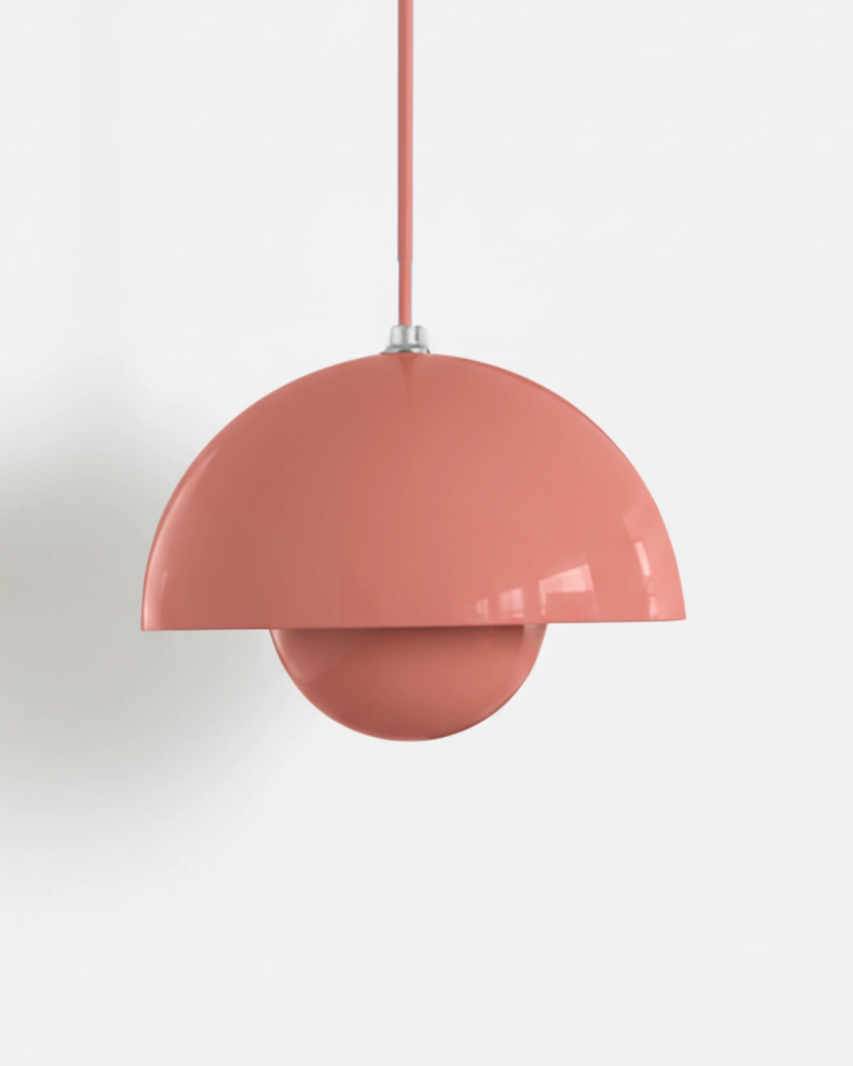 Large 15 in modern pendant light ALTO No.01 in salmon pink lacquer with a pink cord on a white background
