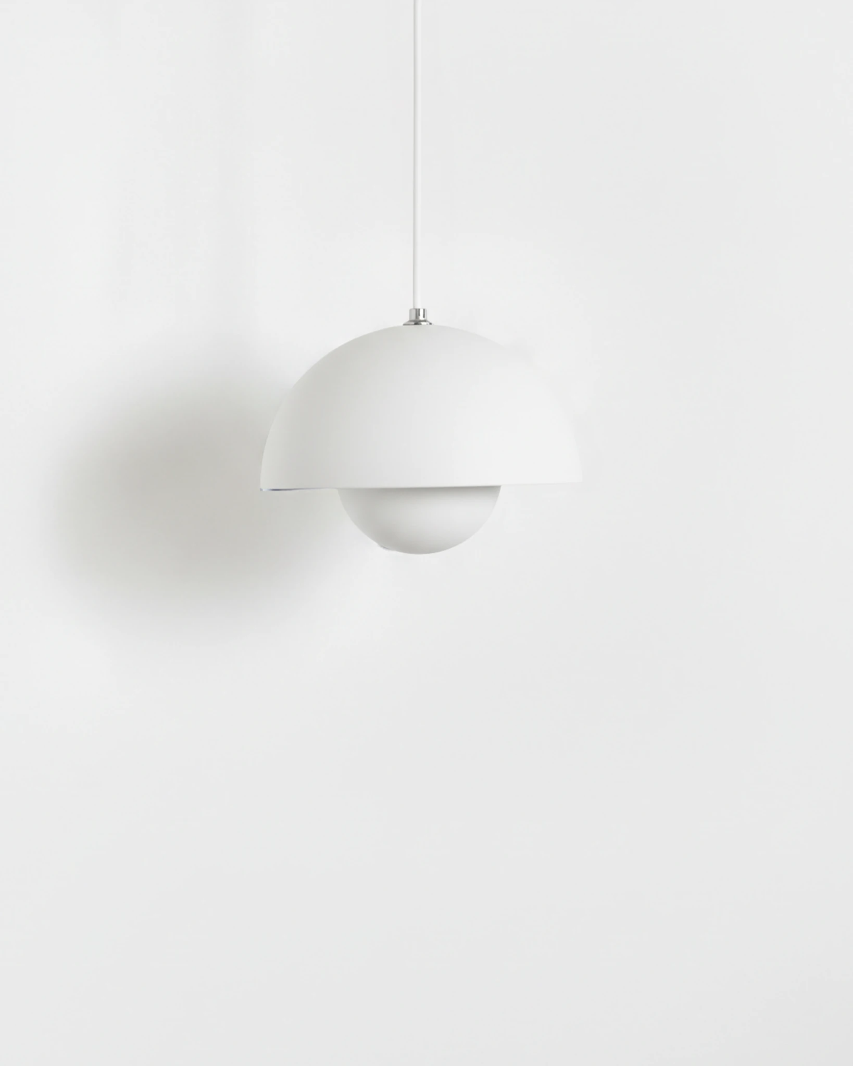 Small 6 in modern pendant light ALTO No.01 in soft white lacquer with a white cord on a white background