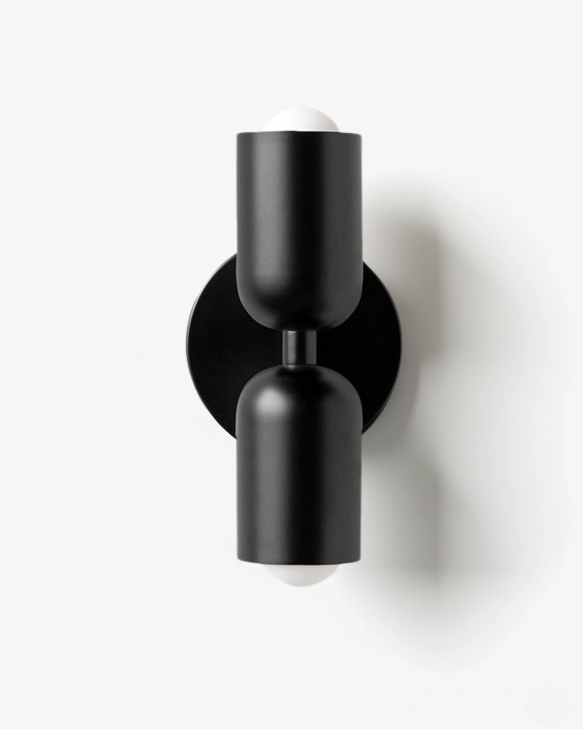 Modern wall sconce TORINO No.01 in Black & Black, all-black forged iron capsules and backplate, unlit