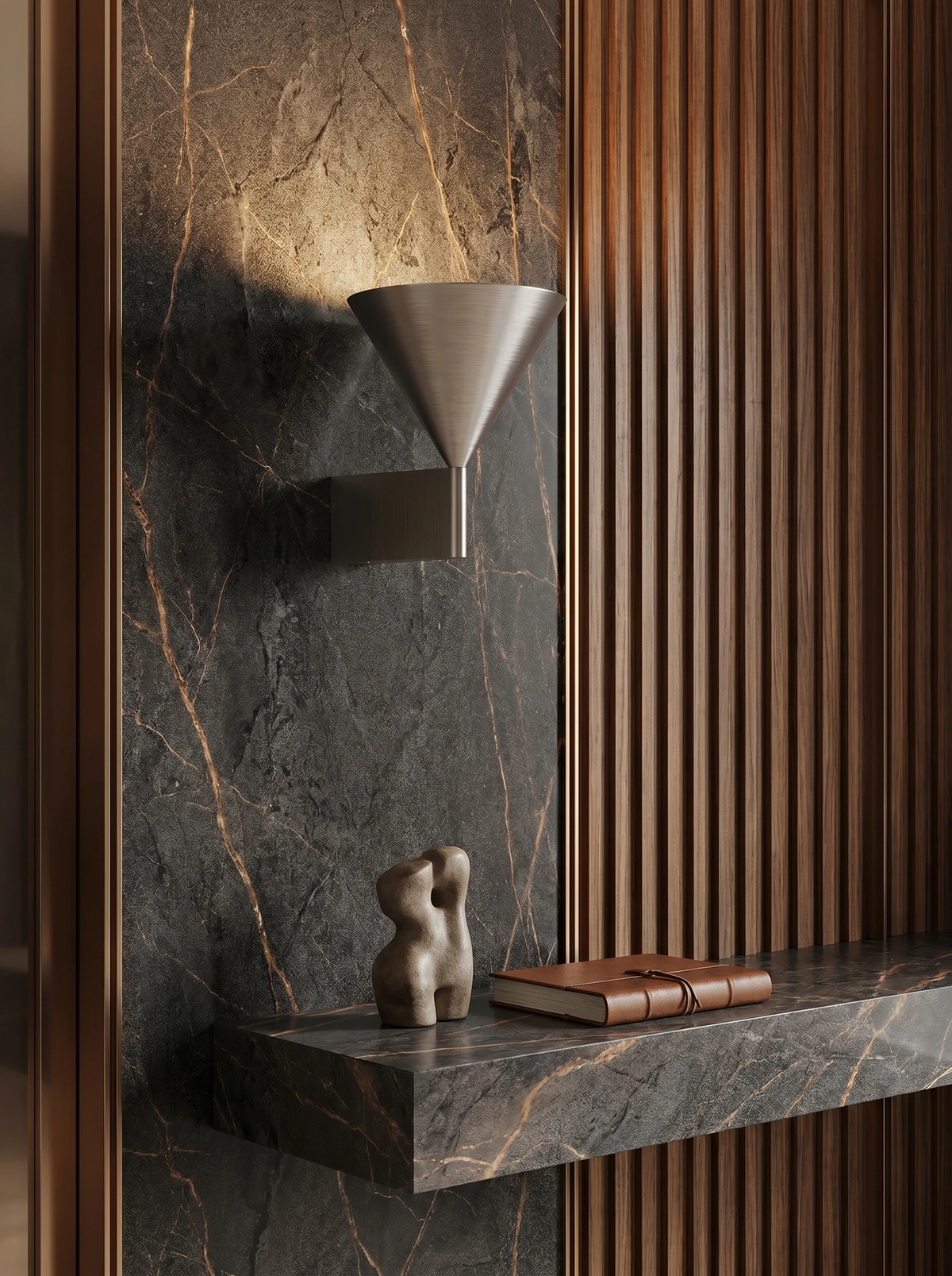 Modern wall sconce ETNA No.01 in brushed aluminum switched on above a marble console with a small sculpture