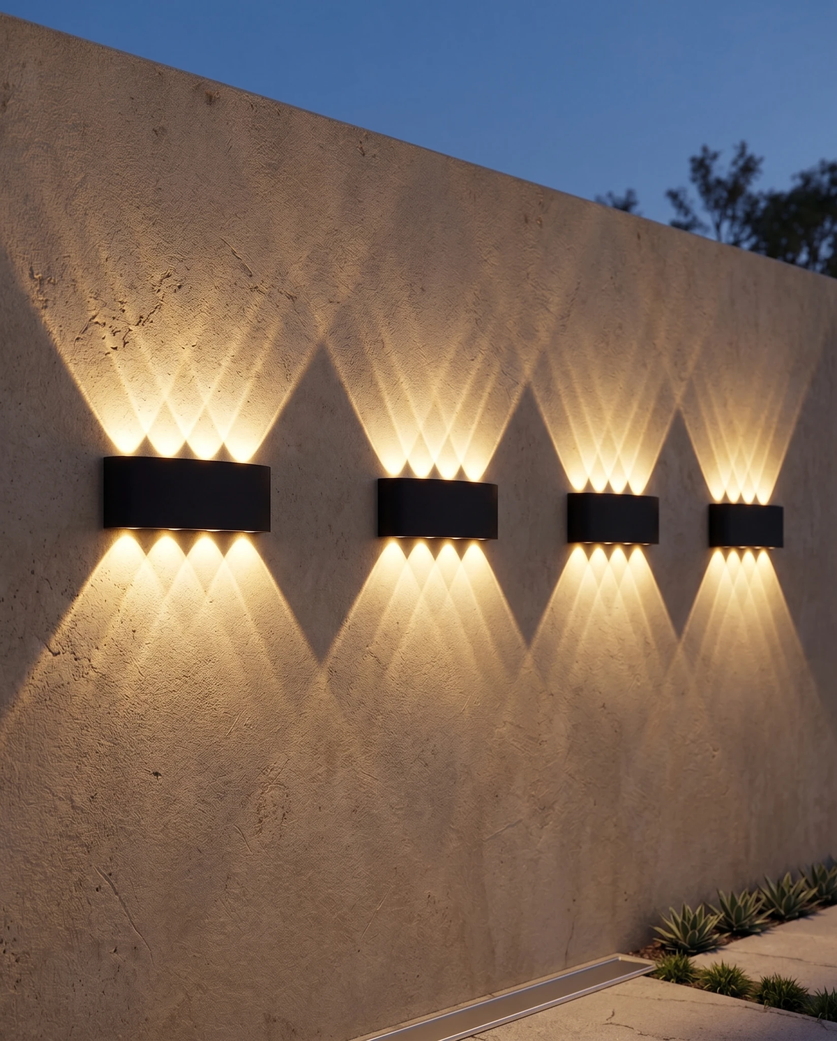 Outdoor wall sconce PALAZZO No.01 in matte black, four units lit in a row across a stone exterior wall