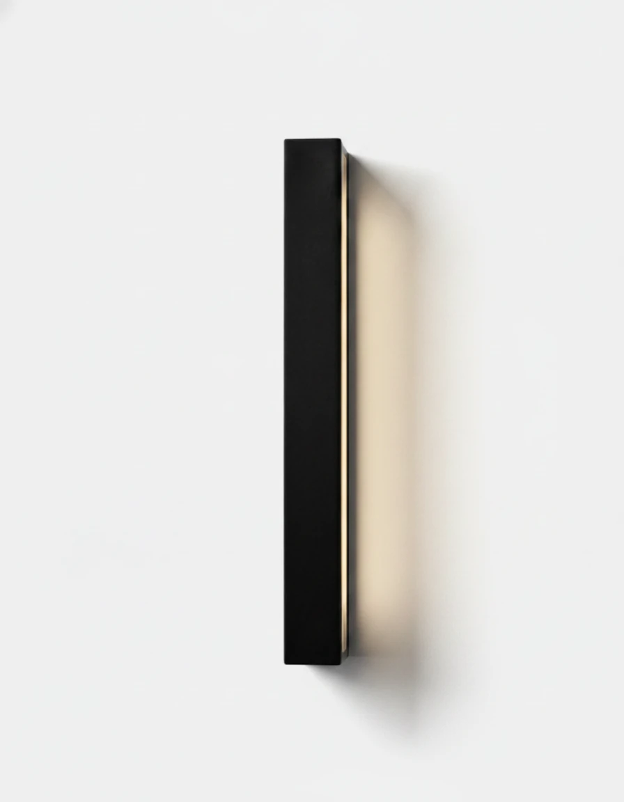 Outdoor wall sconce FRECCIA No.01 in the tall 150 cm (59 in) size, matte black LED bar switched on, edge glow on the wall