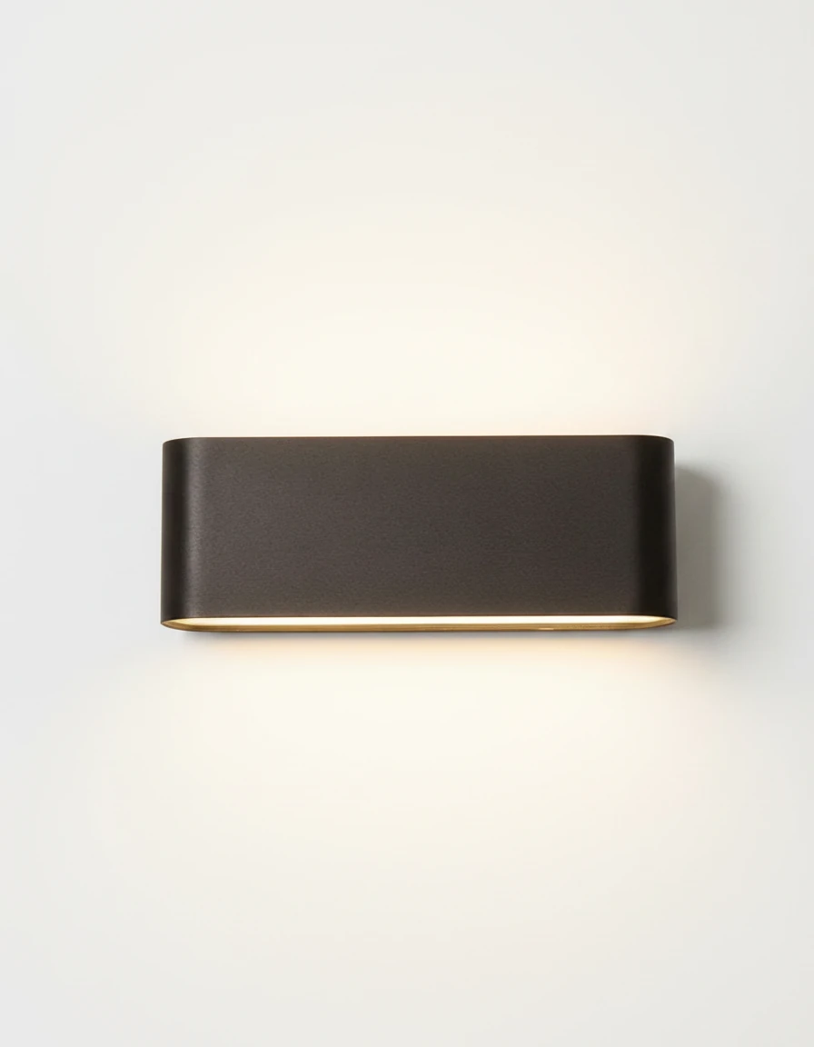 Outdoor wall sconce PISA No.01 large size in deep black, wide pill body lit with light spilling up and down
