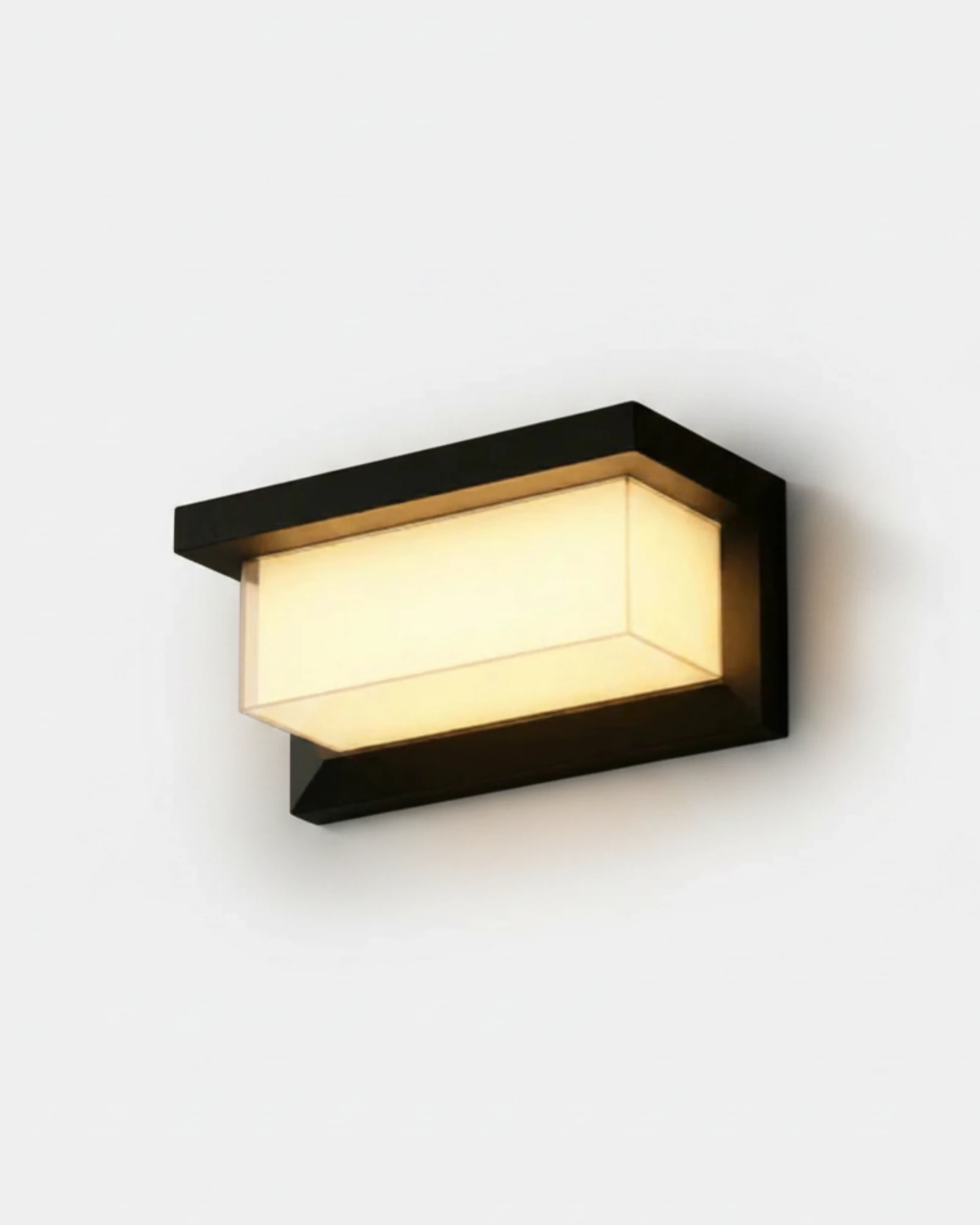 Outdoor wall sconce BRISA No.01 large 12 in, lit acrylic diffuser inside a black angular frame