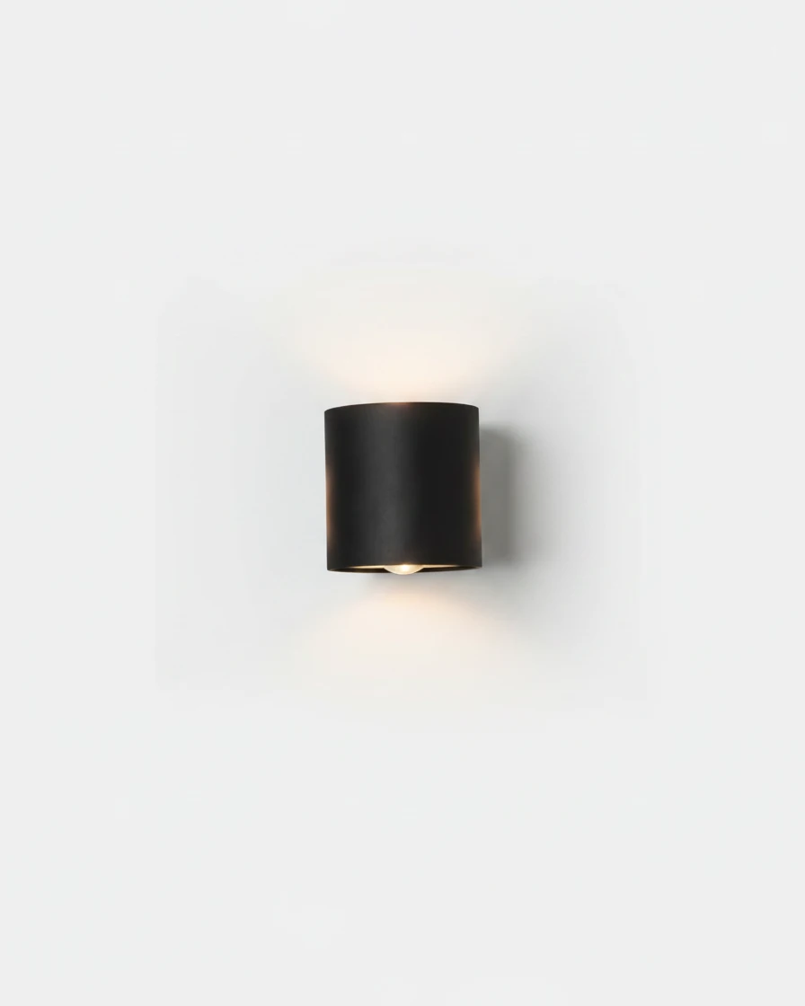 Outdoor wall sconce PALAZZO No.01 in matte black, compact 2W size with one beam up and one down, switched on