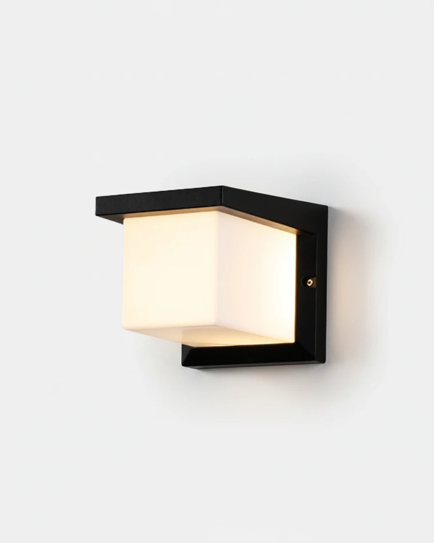 Outdoor wall sconce NOTO No.03, black cast aluminum cube lantern with a frosted glass box, switched on