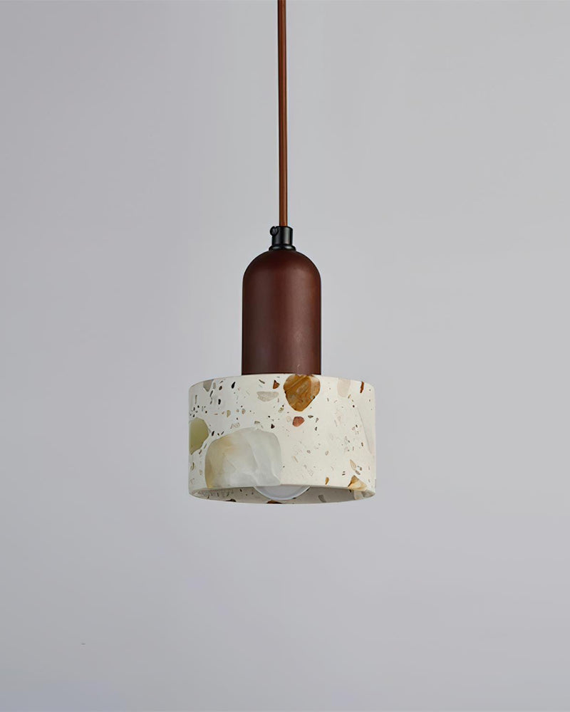 Terrazzo pendant light MOSTO No.01 in the cylinder silhouette with a walnut stem and brown cord, unlit