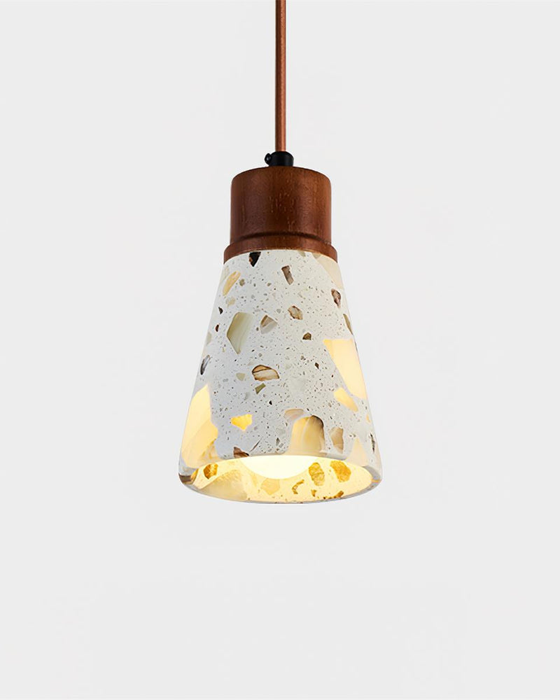 Terrazzo pendant light MOSTO No.01 cone silhouette switched on, walnut stem above the speckled terrazzo shade