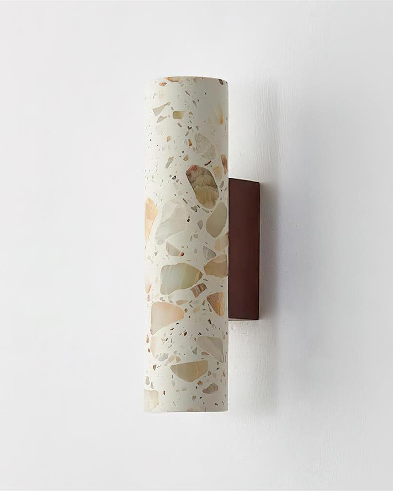 Terrazzo wall sconce INCA No.02 side view, beige terrazzo cylinder mounted on a walnut block, unlit