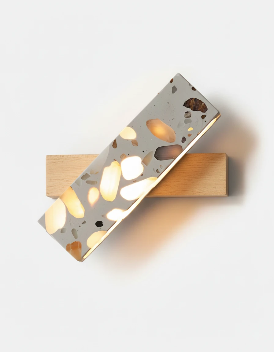 Terrazzo wall sconce PIETRA No.07 on a natural ash base, terrazzo bar lit with amber chips on a white wall