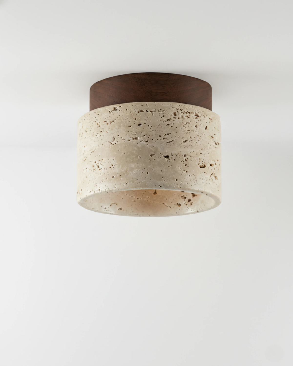 Travertine flush mount ceiling light VERTIN No.05 in Cream Travertine, pitted stone drum with a walnut top cap