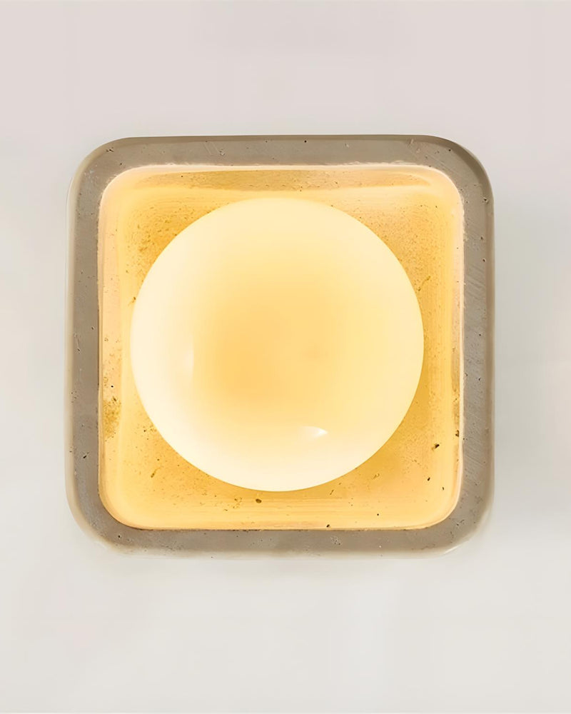 Travertine flush mount ceiling light CUBA No.01 seen straight from below, glowing opal sphere in a square frame